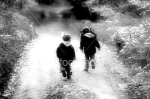 stock-photo-1029491-two-little-children-running-down-dirt-road-black-and-white[1]
